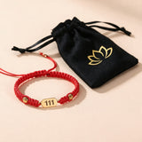 111 Angel Number Bracelet with the black lotus drawstring pouch it arrives in