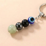 Buddha & Karma Evil Eye Crystal Keychain - Black Tourmaline, Hematite, Labradorite