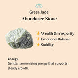 Green jade abundance stone with benefits on a beige background