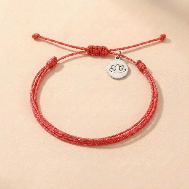 Red string intention bracelet for luck with silver lotus charm